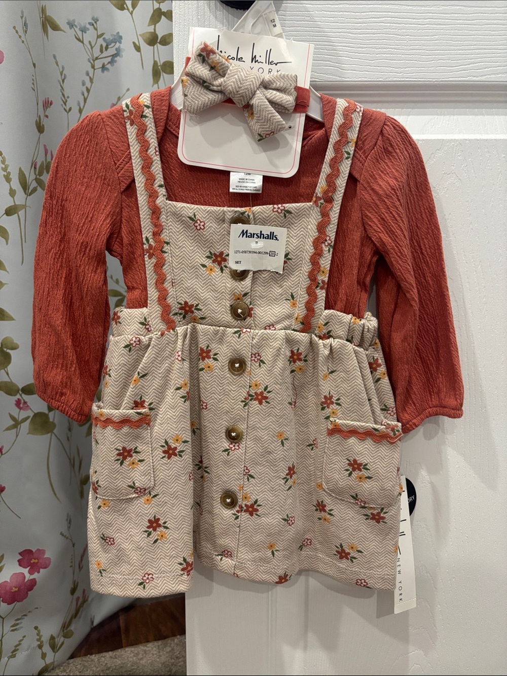 Nicole Miller Baby Rust Onesie with Cream Floral Pinafore and Cream Bow